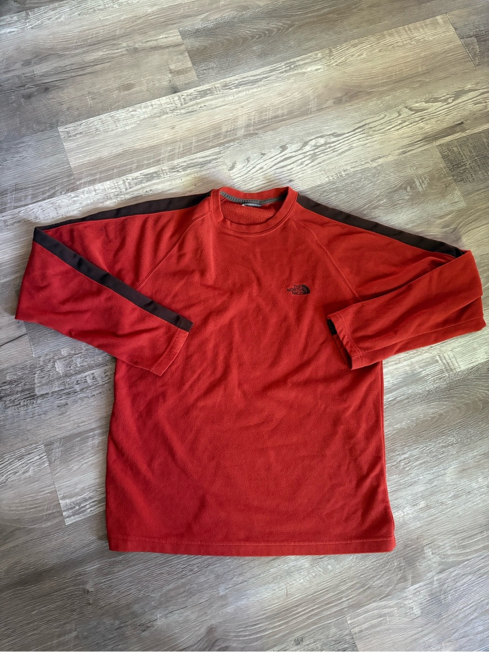 The North Face Men's Orange/Black Colorblock Fleece Crewneck Pullover Logo